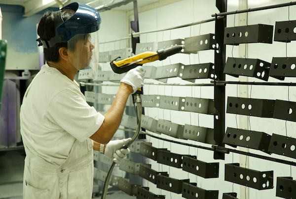 Man painting Metal bars