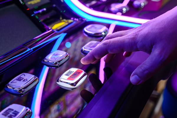 Male playing slot machine