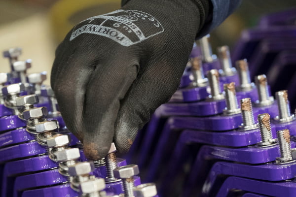 Man assembling metal parts