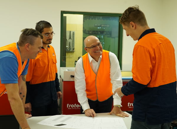 A group of man discussing plan at the table