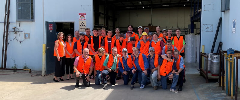 A group of people wearing orange vest