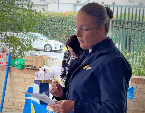 Woman speaking in front of people