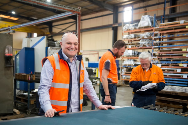 SG - Manufacturing Post Covid-19 Three men working at the warehouse