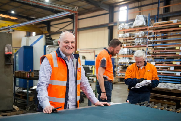 Three men working at the warehouse