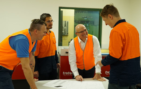 SG - Business can invest with confidence A group of engineer having a discussion