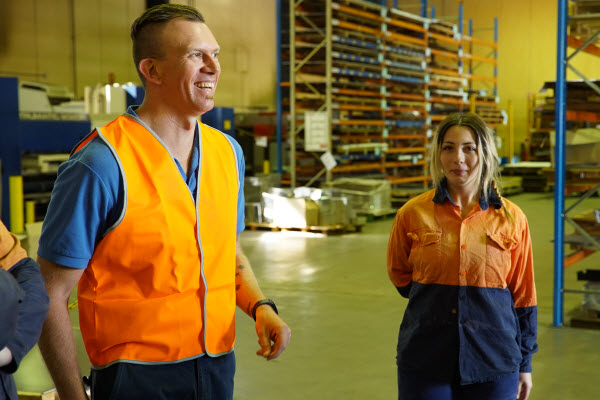 Employees wearing uniform inside the factory