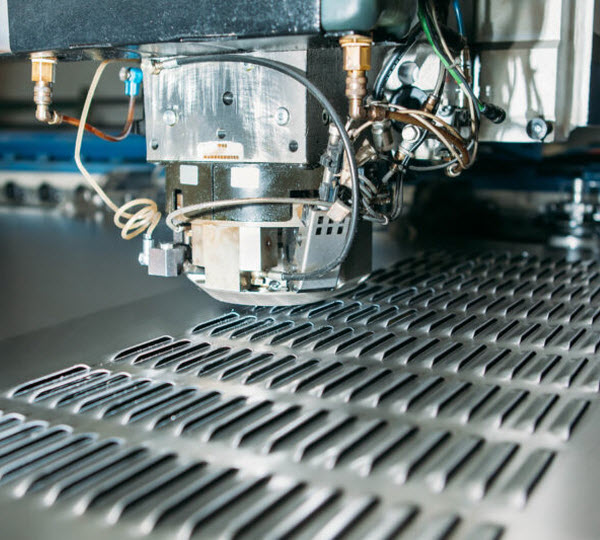 Sevaan Group - Capability advances metal fabrication Operating CNC punching machine